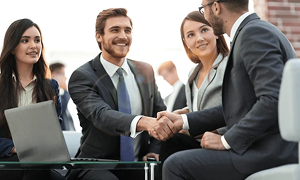 two-colleagues-handshaking-after-meeting-600nw-1192564624 1